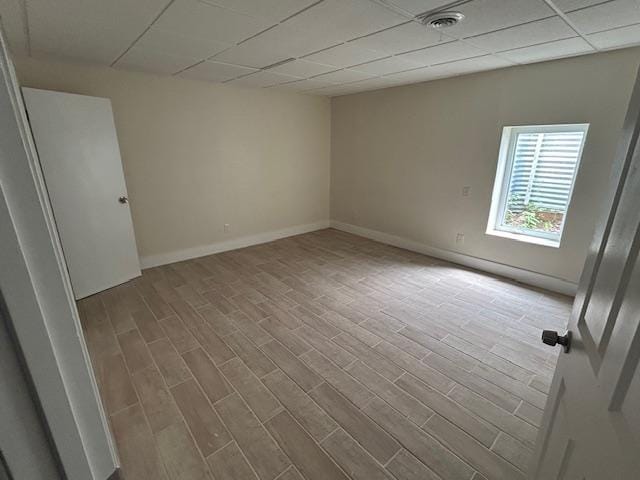504 8th Ave, Grand Rapids, MN 55744 - empty room with a paneled ceiling and wood finished floors