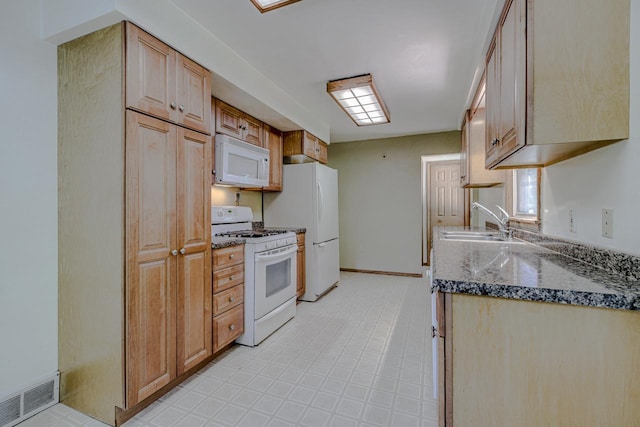 1970 Maryknoll Ave, Maplewood, MN 55109 - kitchen with white appliances and dark stone counters