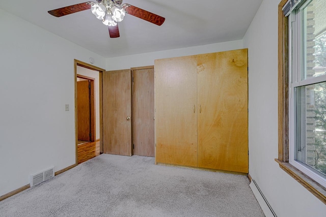 1970 Maryknoll Ave, Maplewood, MN 55109 - empty room featuring light colored carpet, ceiling fan, and healthy amount of natural light