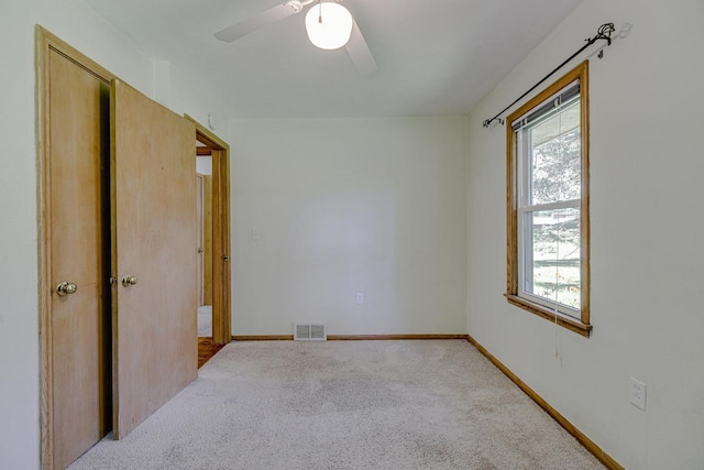1970 Maryknoll Ave, Maplewood, MN 55109 - carpeted empty room featuring ceiling fan and baseboards