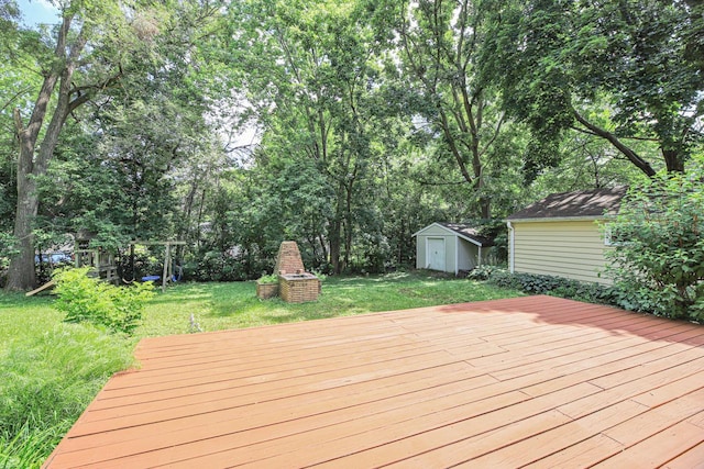 1970 Maryknoll Ave, Maplewood, MN 55109 - wooden terrace featuring a storage unit, a lawn, and a playground