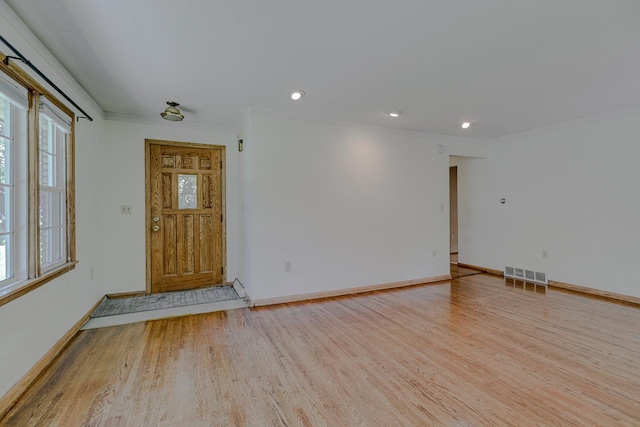 1970 Maryknoll Ave, Maplewood, MN 55109 - foyer with light wood-style floors, healthy amount of natural light, ornamental molding, and recessed lighting