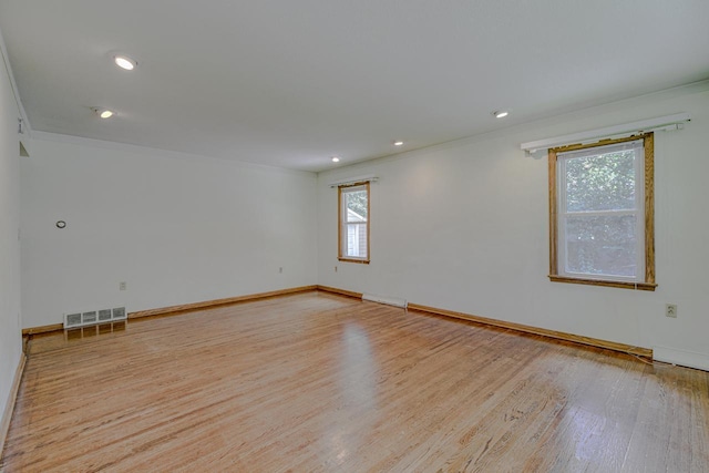 1970 Maryknoll Ave, Maplewood, MN 55109 - spare room with ornamental molding, light wood-style flooring, and recessed lighting