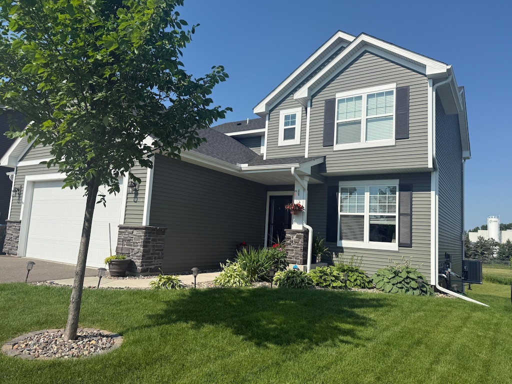5897 Ranger Ave NE, Rogers, MN 55374 - craftsman house with a garage, a front lawn, and driveway