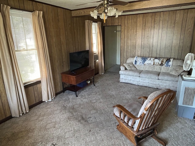 823 5th St, Grand Rapids, MN 55744 - carpeted living room with wooden walls and a ceiling fan