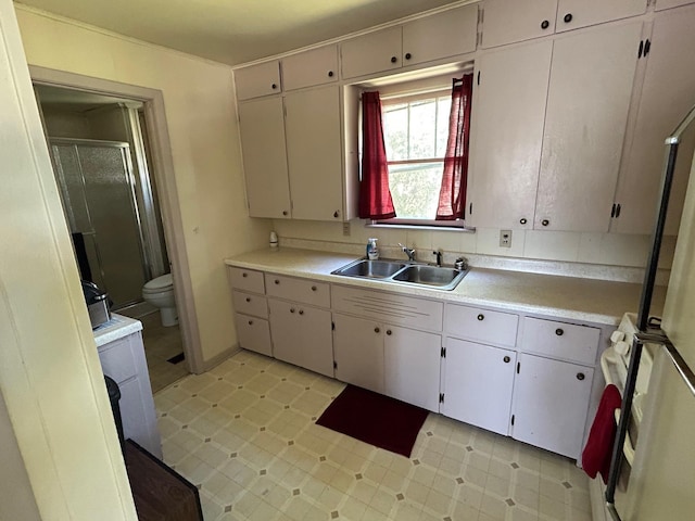 823 5th St, Grand Rapids, MN 55744 - kitchen featuring a sink and light countertops