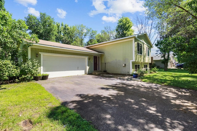 8972 Trista Ln, Saint Bonifacius, MN 55375 - view of front of home with asphalt driveway, a garage, and a front lawn