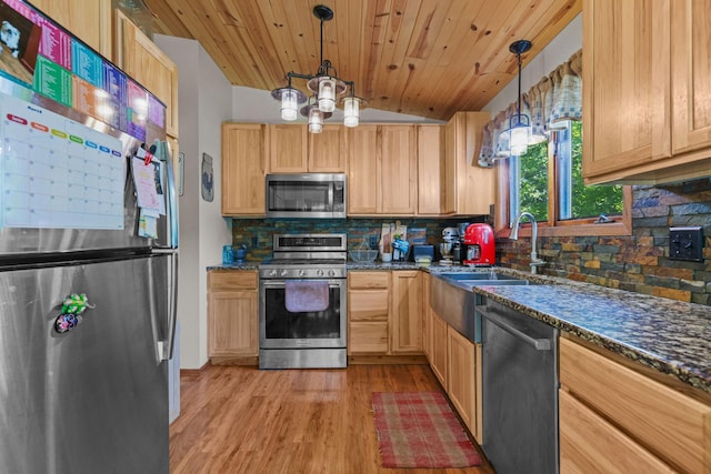 8972 Trista Ln, Saint Bonifacius, MN 55375 - kitchen with stainless steel appliances, decorative backsplash, light wood-style flooring, dark stone countertops, and light brown cabinets