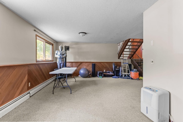 8972 Trista Ln, Saint Bonifacius, MN 55375 - game room featuring carpet flooring, baseboard heating, wood walls, a textured ceiling, and wainscoting