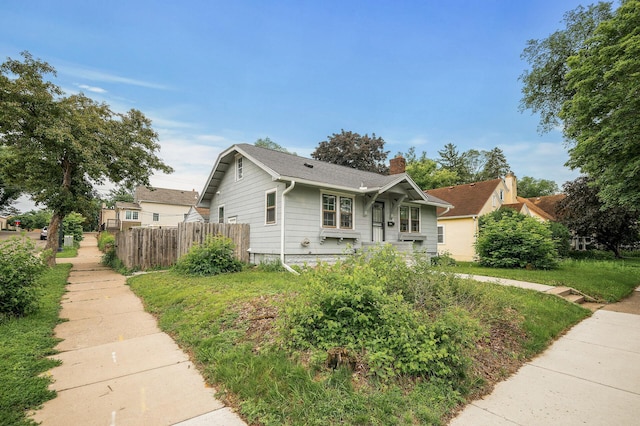 4301 Columbus Ave, Minneapolis, MN 55407 - bungalow-style house featuring a chimney and a shingled roof