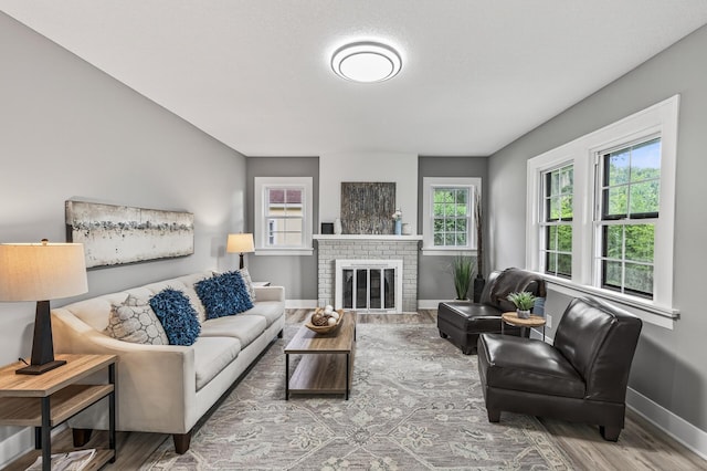 4301 Columbus Ave, Minneapolis, MN 55407 - living area with wood finished floors and a brick fireplace