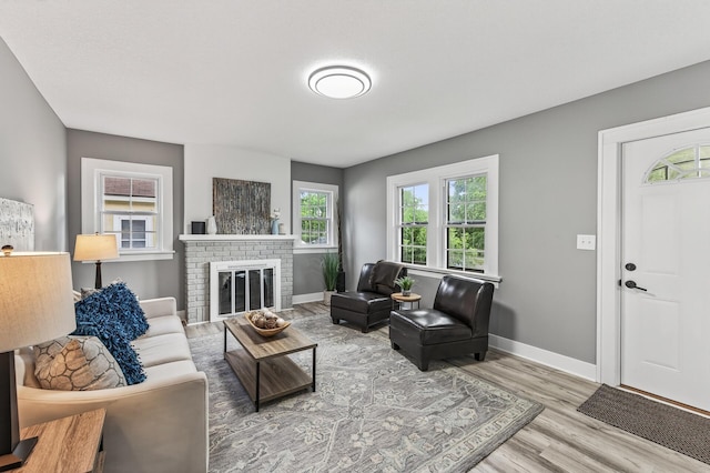 4301 Columbus Ave, Minneapolis, MN 55407 - living room featuring wood finished floors and a brick fireplace