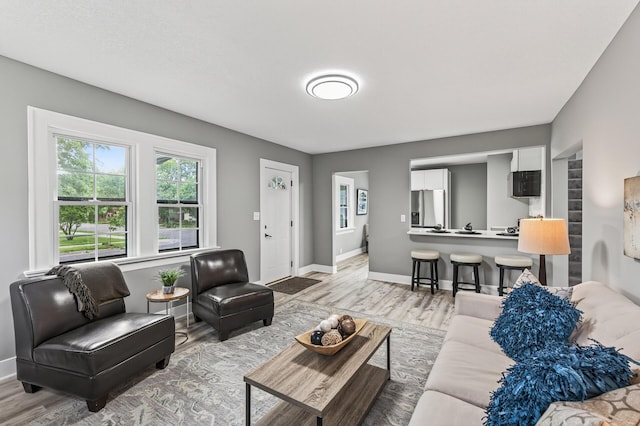 4301 Columbus Ave, Minneapolis, MN 55407 - living room featuring baseboards and wood finished floors