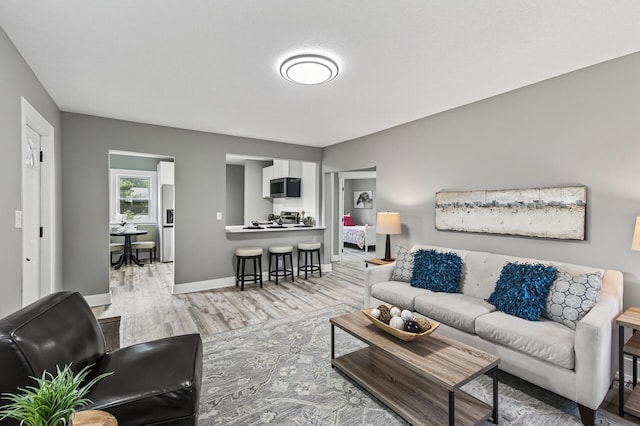 4301 Columbus Ave, Minneapolis, MN 55407 - living room featuring light wood finished floors and baseboards