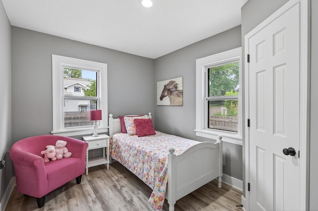 4301 Columbus Ave, Minneapolis, MN 55407 - bedroom featuring baseboards and wood finished floors