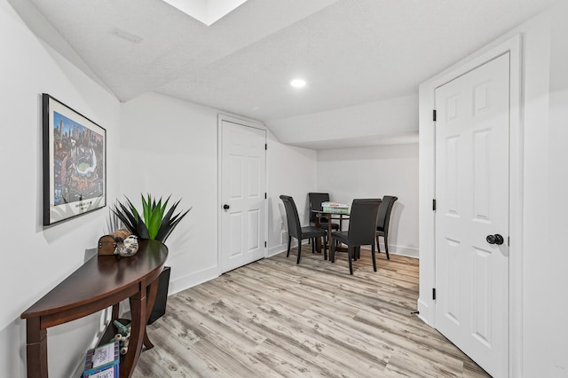4301 Columbus Ave, Minneapolis, MN 55407 - dining room featuring light wood-style floors, lofted ceiling, and recessed lighting