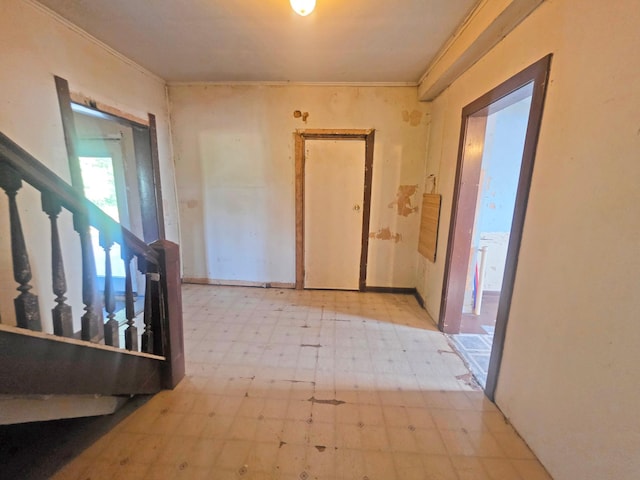 2001 Shilhon Rd, Duluth, MN 55804 - hallway with tile patterned floors, ornamental molding, and stairway