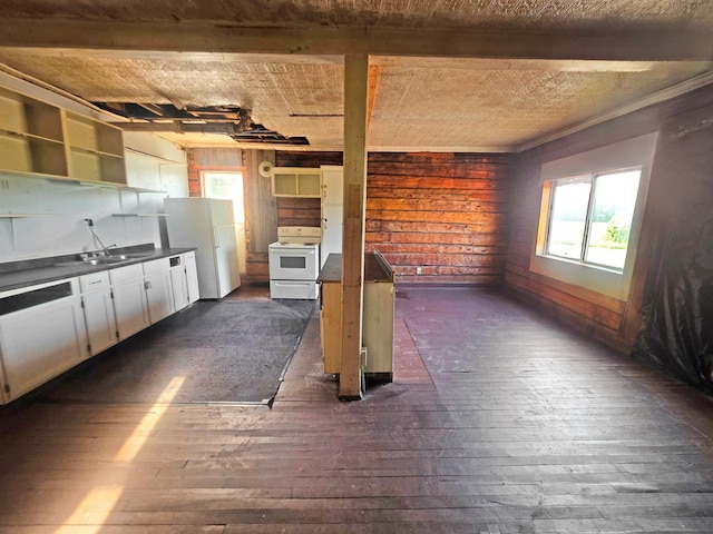 2001 Shilhon Rd, Duluth, MN 55804 - unfurnished living room featuring dark wood-style flooring, healthy amount of natural light, and wooden walls