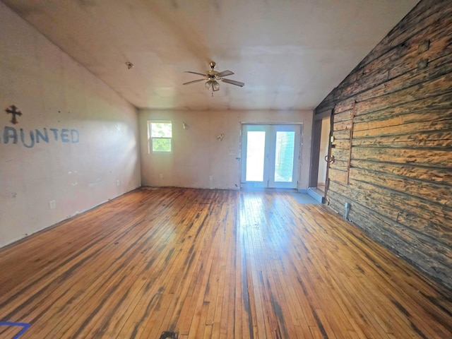 2001 Shilhon Rd, Duluth, MN 55804 - empty room with vaulted ceiling, a ceiling fan, hardwood / wood-style floors, and wood walls
