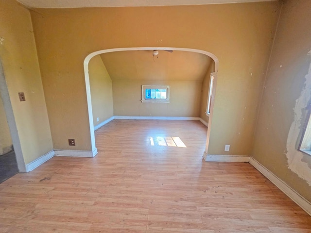 2001 Shilhon Rd, Duluth, MN 55804 - spare room with arched walkways, wood finished floors, and vaulted ceiling