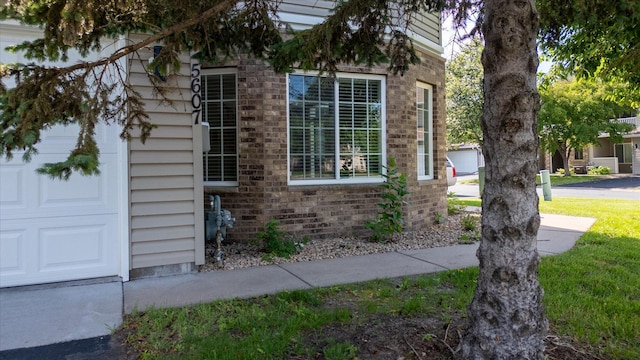 5607 100th Ln N, Brooklyn Park, MN 55443 - view of home's exterior with brick siding