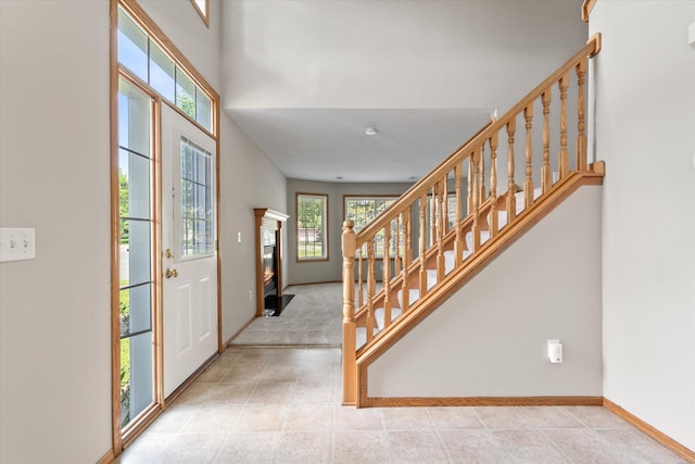 5607 100th Ln N, Brooklyn Park, MN 55443 - entrance foyer featuring stairway and baseboards