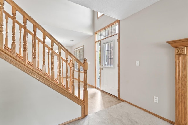5607 100th Ln N, Brooklyn Park, MN 55443 - foyer entrance featuring stairs and light carpet