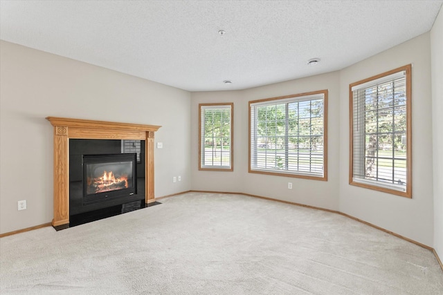 5607 100th Ln N, Brooklyn Park, MN 55443 - unfurnished living room with carpet, a fireplace with flush hearth, and a textured ceiling