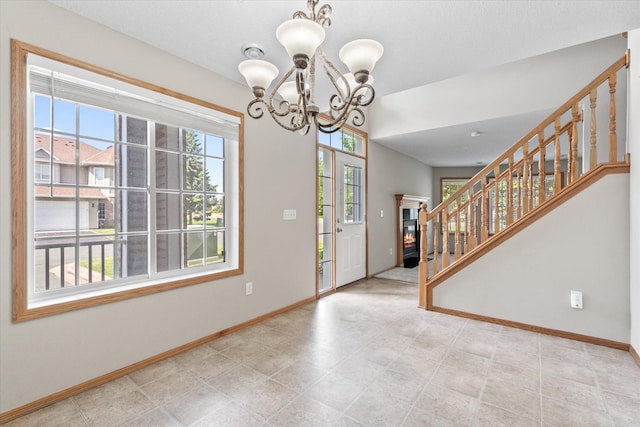 5607 100th Ln N, Brooklyn Park, MN 55443 - foyer entrance featuring stairway and a chandelier