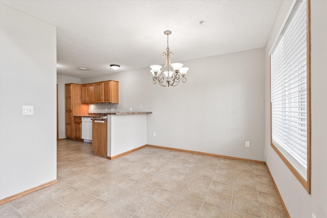 5607 100th Ln N, Brooklyn Park, MN 55443 - kitchen featuring plenty of natural light, a chandelier, dishwasher, a peninsula, and a textured ceiling