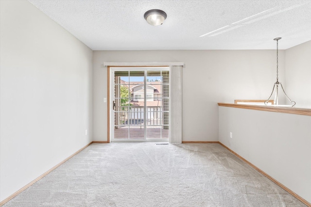 5607 100th Ln N, Brooklyn Park, MN 55443 - empty room with carpet and a textured ceiling