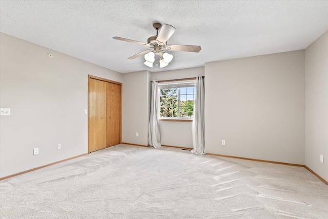 5607 100th Ln N, Brooklyn Park, MN 55443 - spare room with a ceiling fan, light carpet, and a textured ceiling