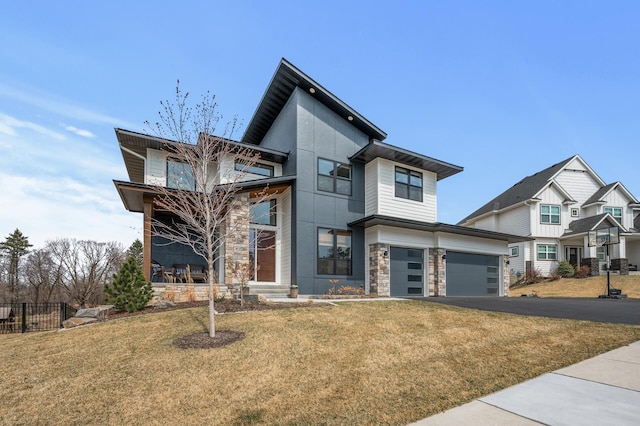 16830 59th Ave N, Plymouth, MN 55446 - contemporary house with stone siding, driveway, and a garage