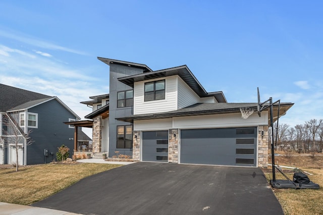 16830 59th Ave N, Plymouth, MN 55446 - contemporary house featuring stone siding, asphalt driveway, a front yard, and an attached garage