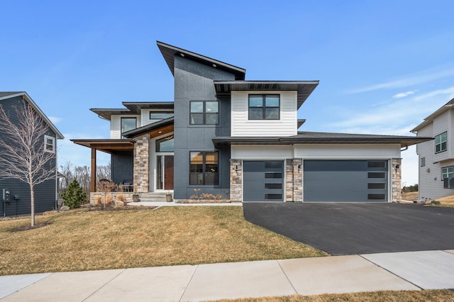 16830 59th Ave N, Plymouth, MN 55446 - contemporary home featuring stone siding, driveway, a front lawn, and covered porch