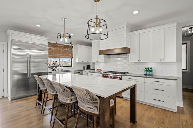 16830 59th Ave N, Plymouth, MN 55446 - kitchen featuring stainless steel appliances, white cabinetry, recessed lighting, and decorative backsplash