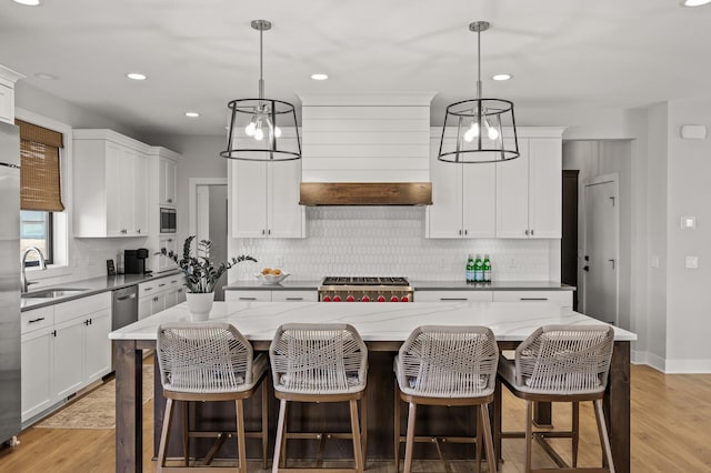 16830 59th Ave N, Plymouth, MN 55446 - kitchen featuring tasteful backsplash, a kitchen island, appliances with stainless steel finishes, white cabinets, and recessed lighting