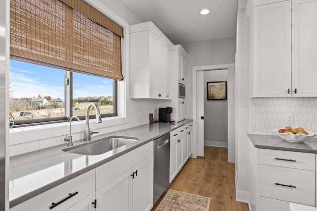 16830 59th Ave N, Plymouth, MN 55446 - kitchen with dishwasher, white cabinetry, recessed lighting, light wood-style floors, and tasteful backsplash