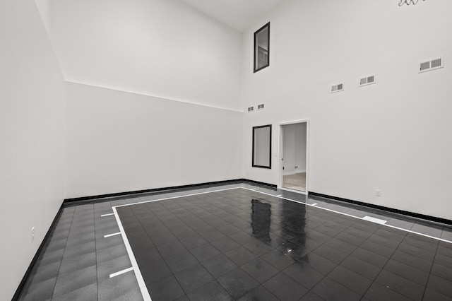 16830 59th Ave N, Plymouth, MN 55446 - tiled empty room with baseboards and a towering ceiling