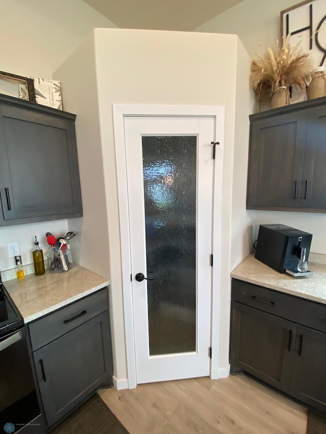 1819 67th Ave S, Fargo, ND 58104 - kitchen featuring range with electric stovetop and light wood-type flooring