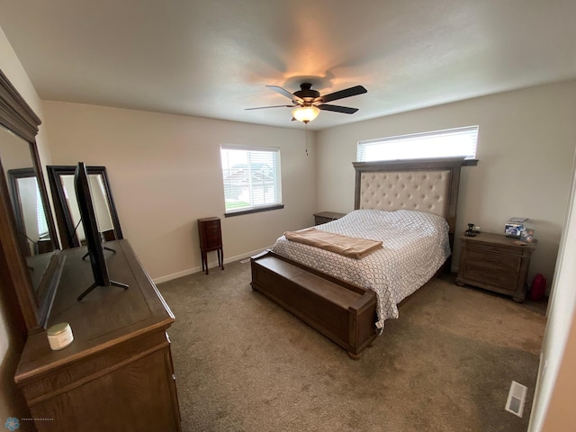 1819 67th Ave S, Fargo, ND 58104 - carpeted bedroom featuring a ceiling fan and baseboards