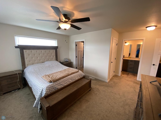 1819 67th Ave S, Fargo, ND 58104 - bedroom with light colored carpet, ceiling fan, and ensuite bath