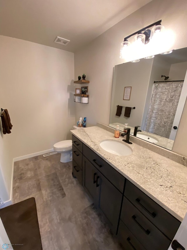 1819 67th Ave S, Fargo, ND 58104 - bathroom featuring vanity and toilet