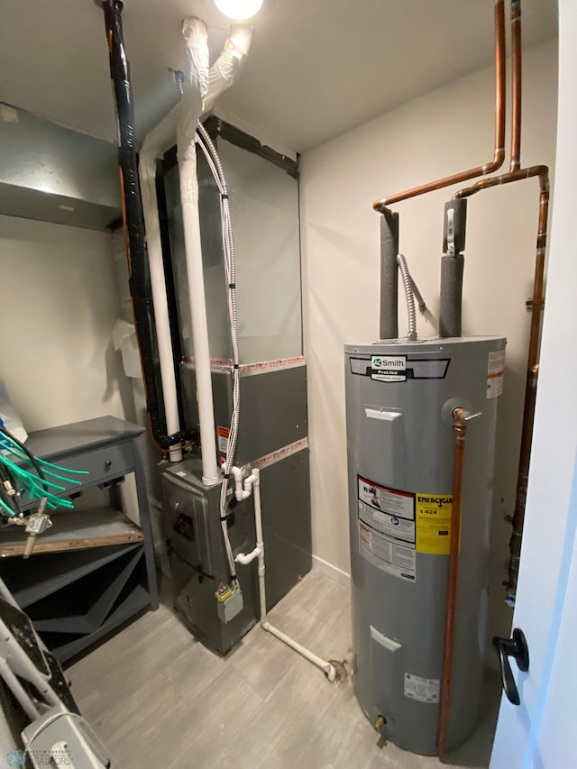 1819 67th Ave S, Fargo, ND 58104 - utility room featuring water heater and heating unit