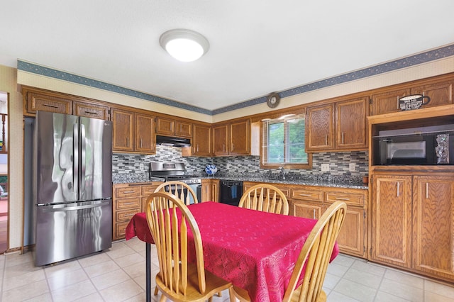 2539 83rd Ct N, Brooklyn Park, MN 55444 - kitchen with black appliances, light tile patterned flooring, and tasteful backsplash