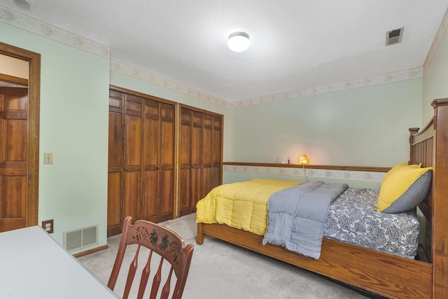 2539 83rd Ct N, Brooklyn Park, MN 55444 - bedroom featuring a textured ceiling and light colored carpet