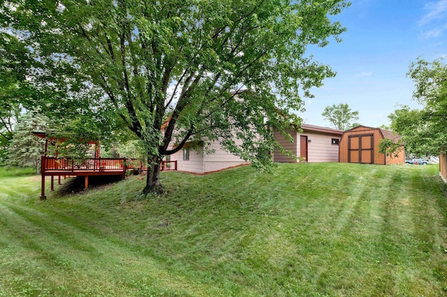 2539 83rd Ct N, Brooklyn Park, MN 55444 - view of green lawn with a storage unit and a deck