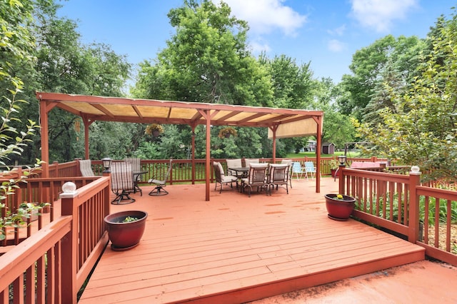 2539 83rd Ct N, Brooklyn Park, MN 55444 - wooden deck featuring outdoor dining space and view of wooded area