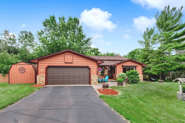 2539 83rd Ct N, Brooklyn Park, MN 55444 - view of front facade with asphalt driveway, an attached garage, a front yard, a storage shed, and brick siding