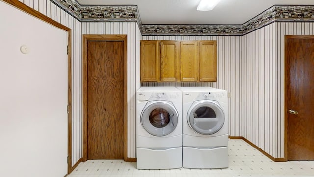 1930 Wilby Rd, Albert Lea, MN 56007 - washroom with light floors, washer and clothes dryer, cabinet space, and wallpapered walls